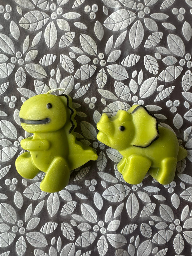 Little dinosaur candle in green color
